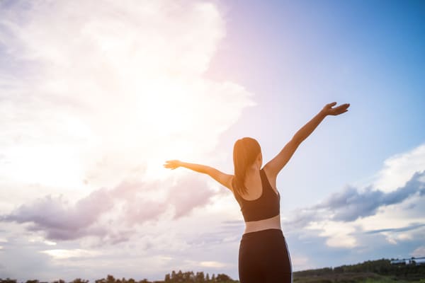 happy-smiling-athletic-woman-with-arms-outstretched.jpg