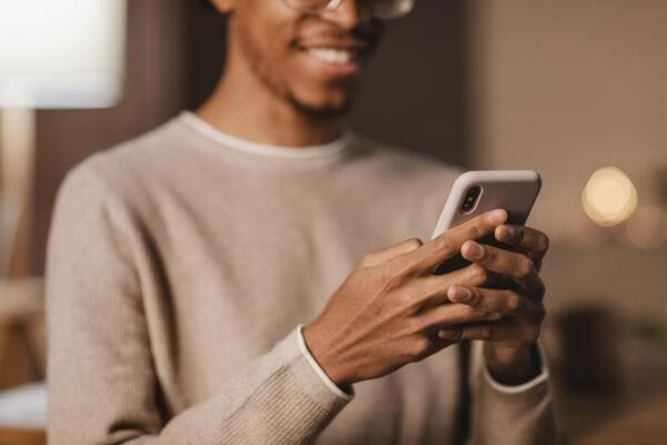 smiley-man-using-modern-smartphone.jpg